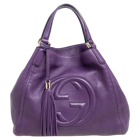 gucci purple handbags.